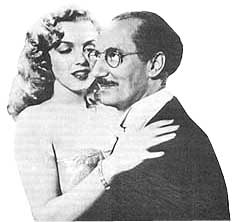 Marilyn con Groucho Marx en la pelcula Amor en conserva (7789 bytes)